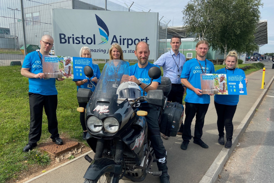 People standing outside Bristol Airport from one water